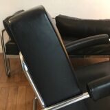 Sofa and armchair in chrome metal and black leather