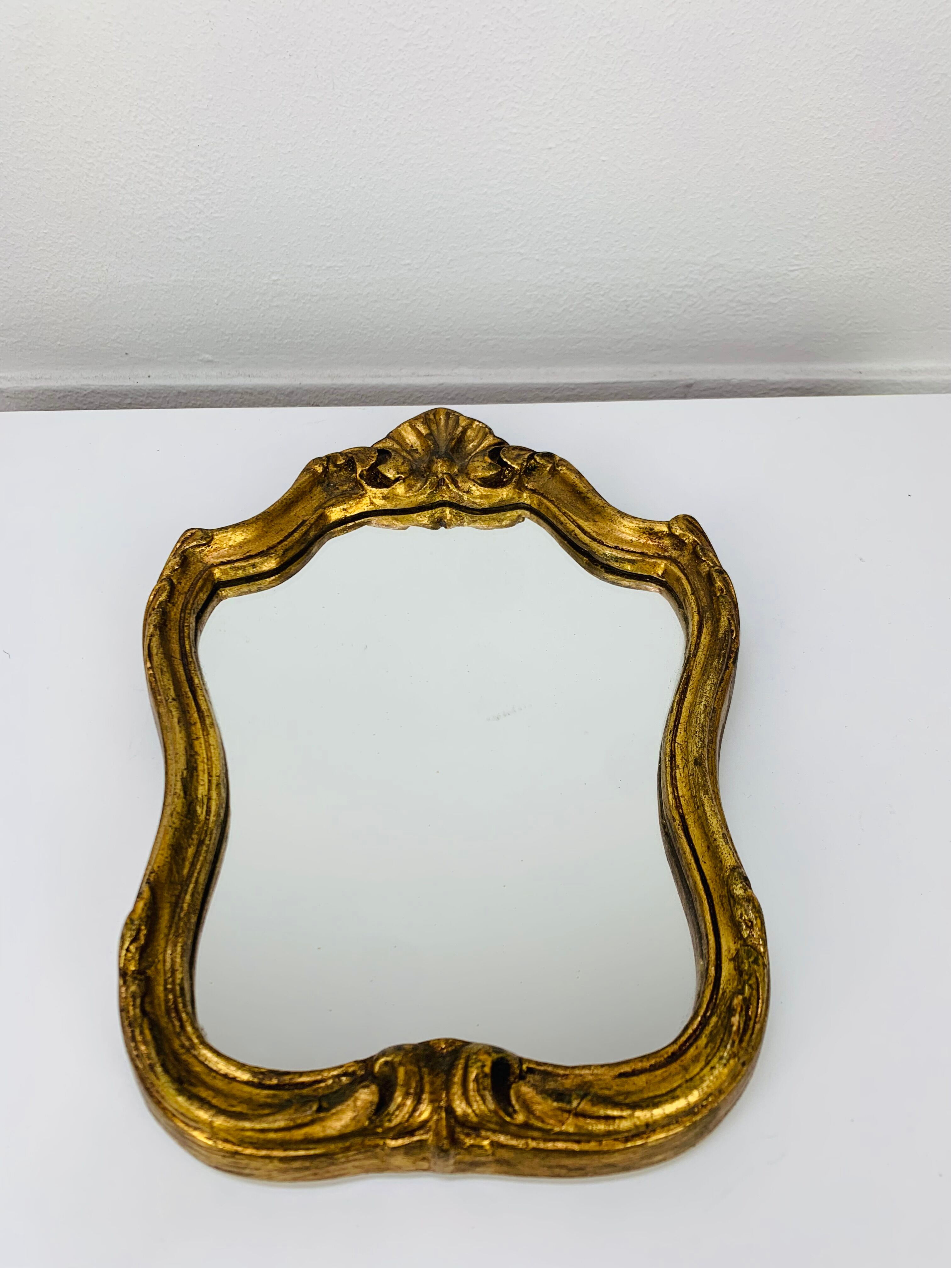 Vintage gilded wood mirror in classic style