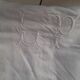 Old sheet quite thick with monogram.