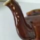 Vintage brown glazed earthenware teapot, mid-century sculptural decor.