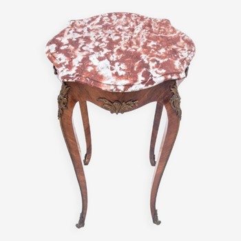 Table with a marble top, France, around 1910.