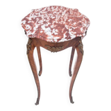Table with a marble top, France, around 1910.