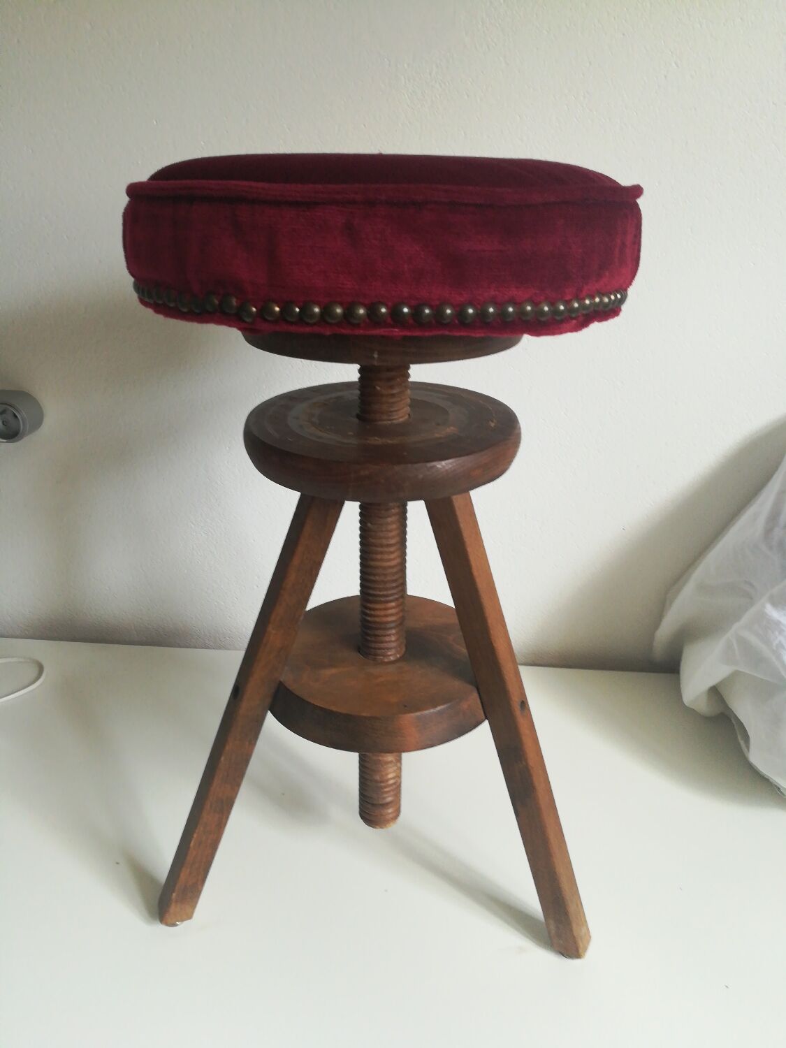 Old piano stool with screw