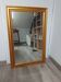Mirror in an elegant gold frame. 84 x 57.