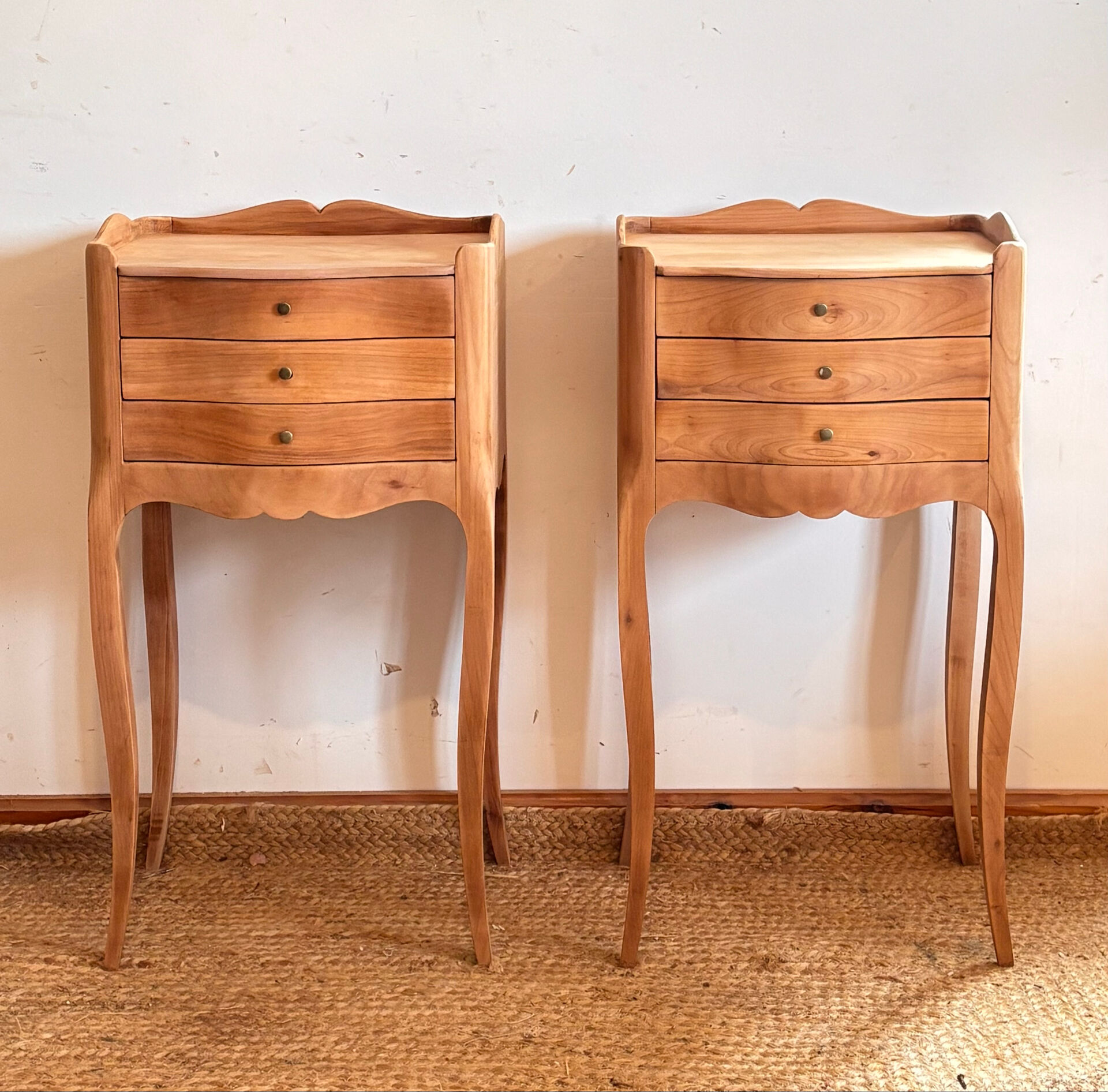 Pair of antique bedside tables / nightstands in raw wood.