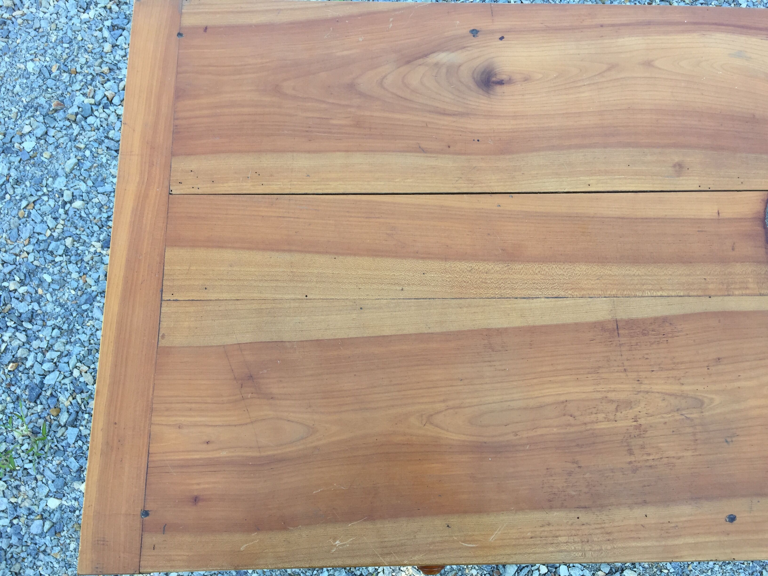 Old farmhouse table louis Philippe style in solid cherry with turned feet.