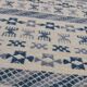 Handmade white and blue ethnic carpet