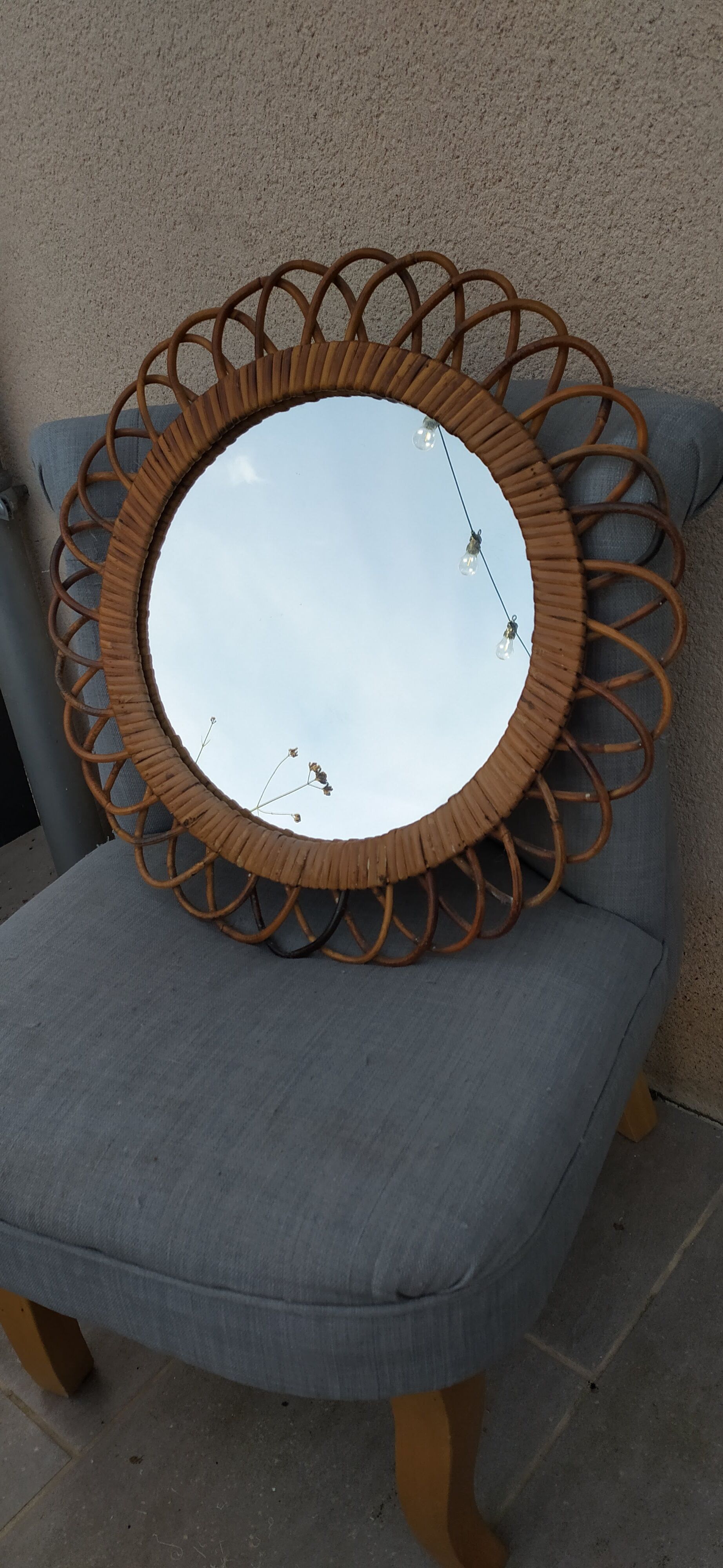 Vintage mirror in rattan flowers, sun