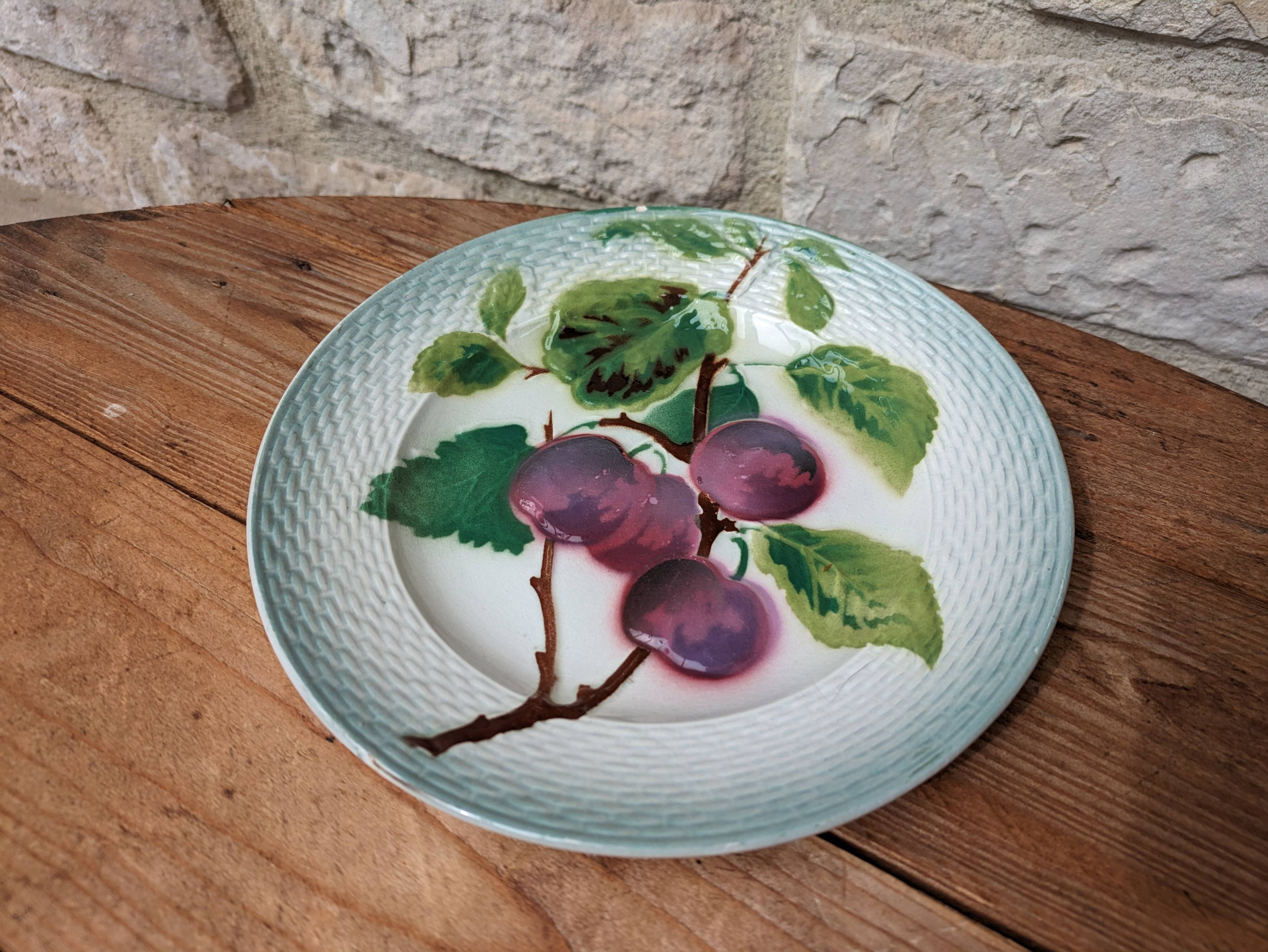 Old barbotine plate with plum motif Saint Amand Hamage