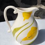 Pitcher with yellow flowers