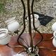 Vintage 8-light chandelier in brass and frosted white and gold glass.