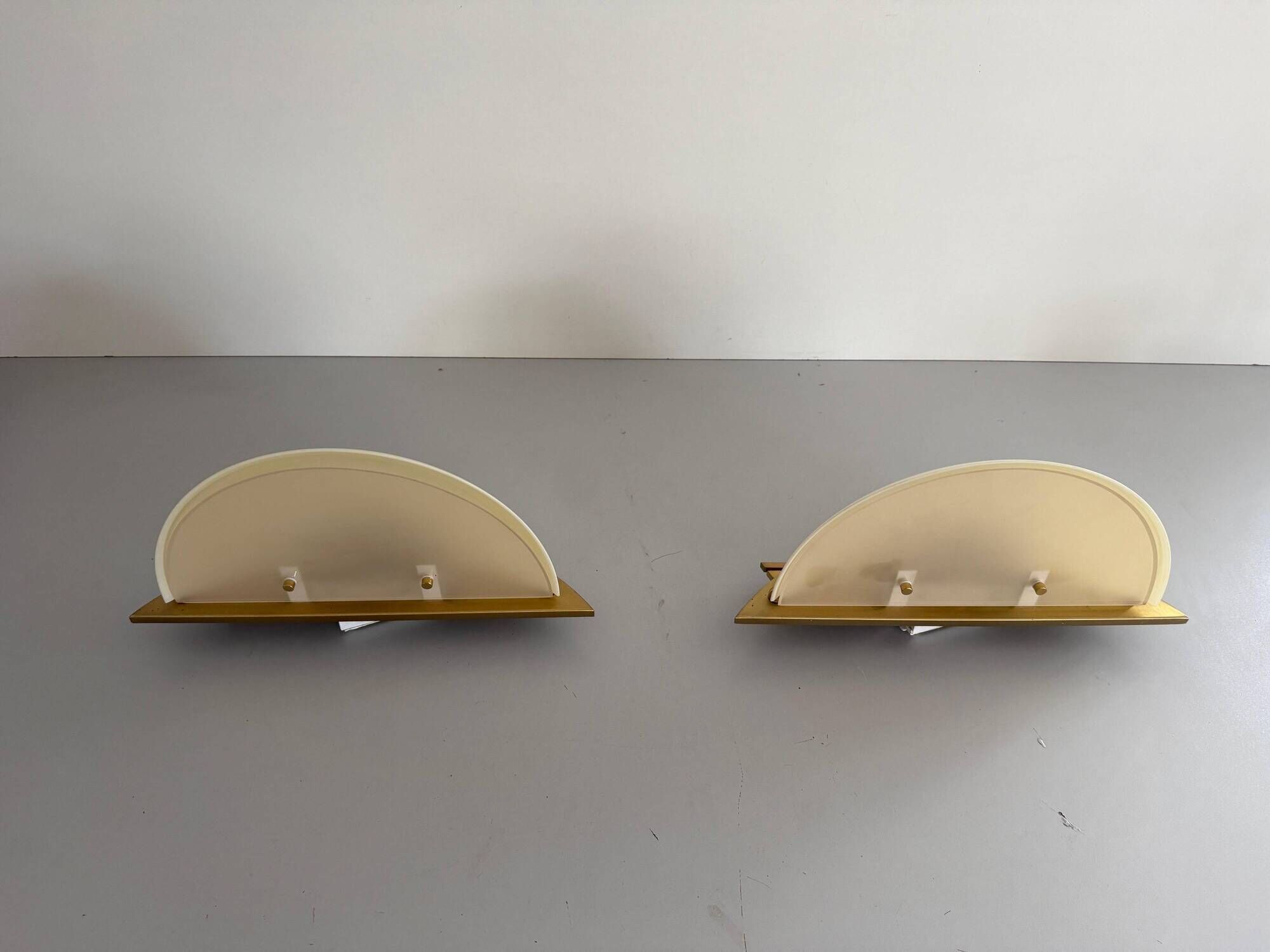 Pair of brass and glass wall lights from the Spage era, 1980, Germany.