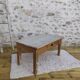 Patinated coffee table with a drawer