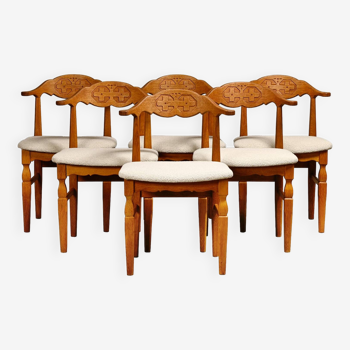 Henning Kjærnulf dining chairs set in Oak and Off White Bouclé, Denmark, 1960s