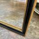 Miroir rectangulaire en bois noir et doré 45 x 35 cm