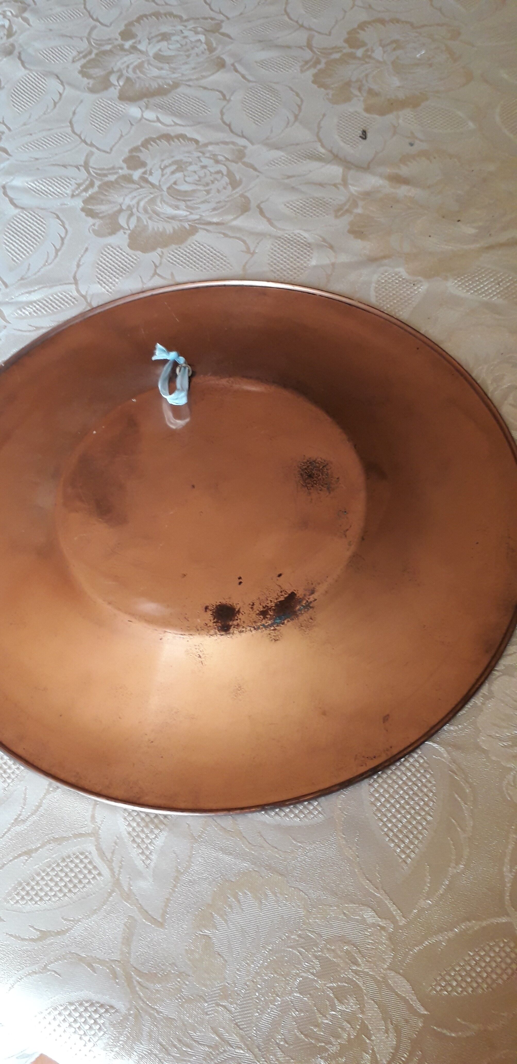 Oriental dish in chiseled red copper