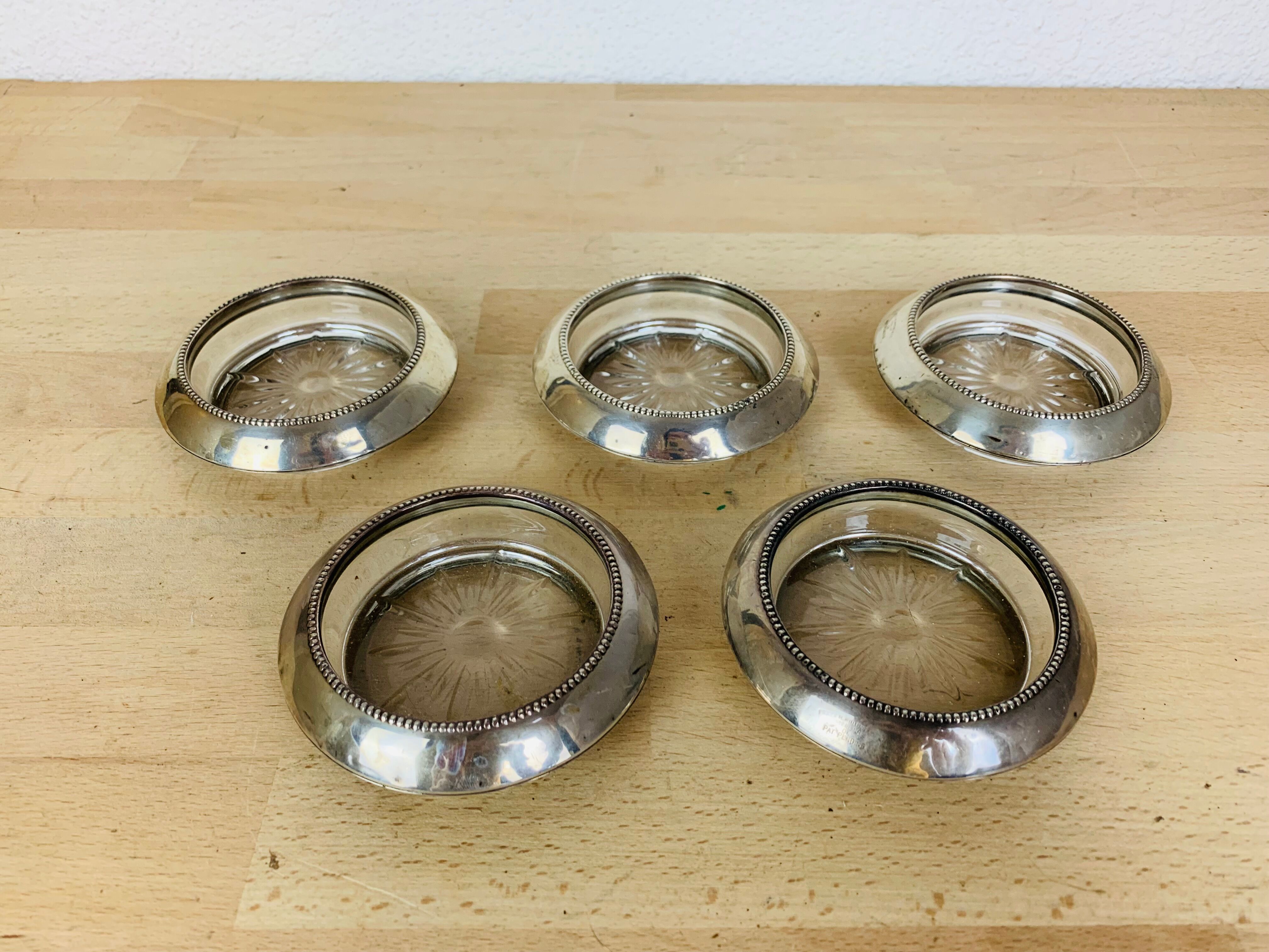 5 silver metal coasters Frank Whiting & Co