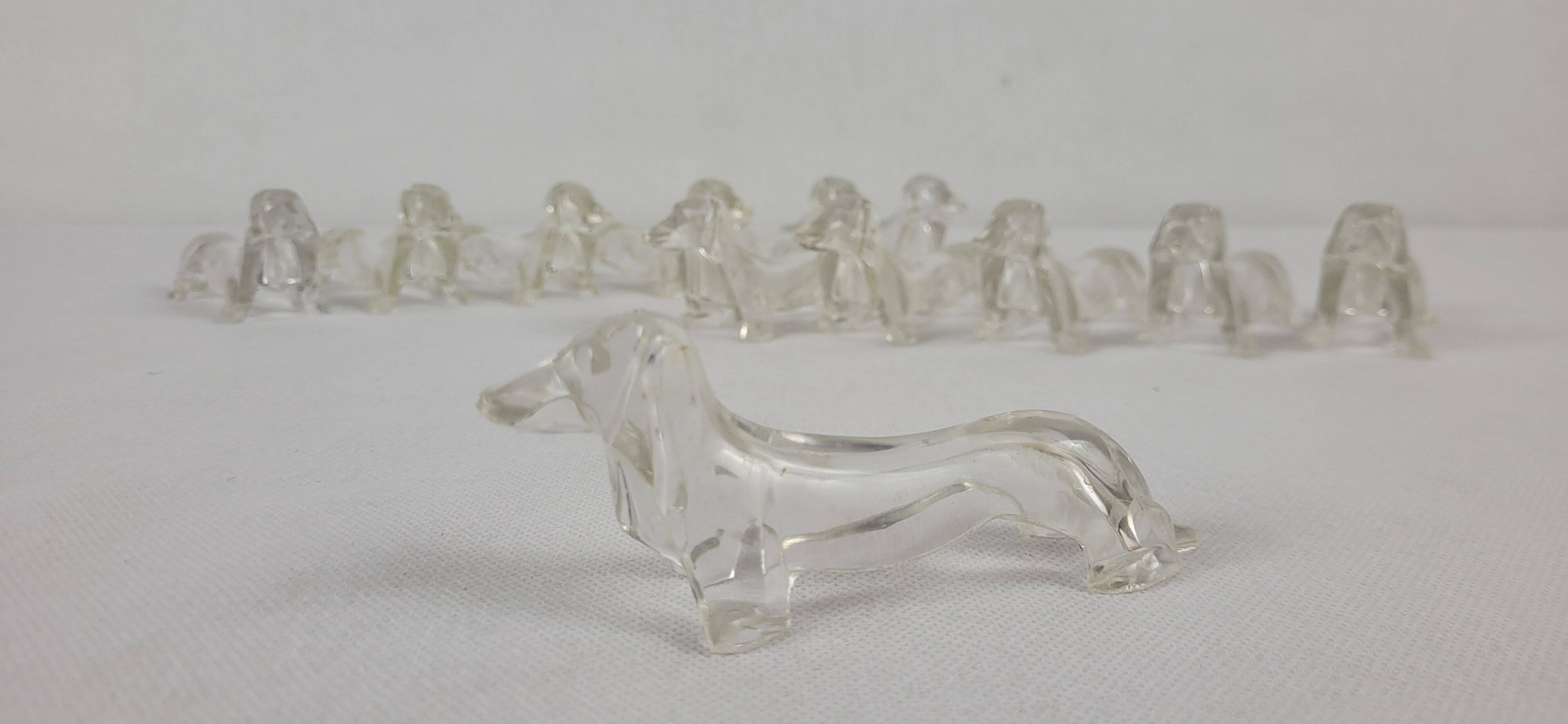 12 plastic dachshund/bassett knife holders 1970s