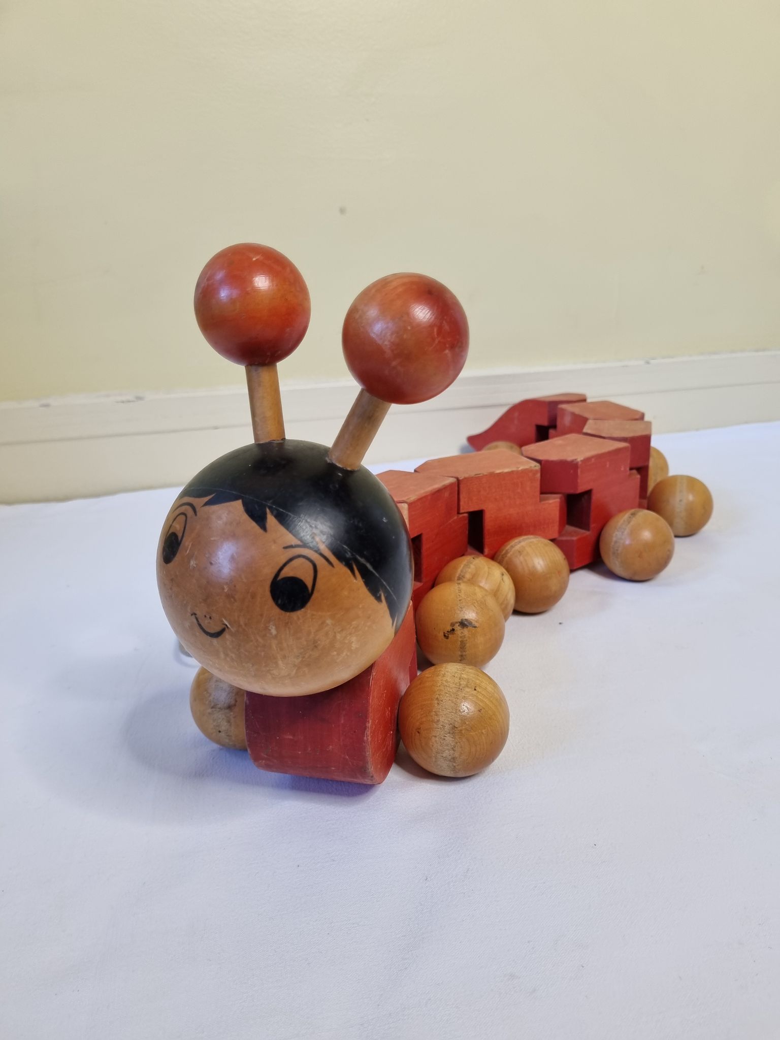 Vintage pulling toy, "centipede", 82 cm, made in Switzerland