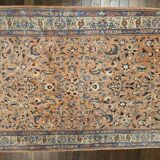 Large wool and silk oriental carpet.