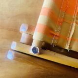 Old foldable beach seat in wood and canvas for children