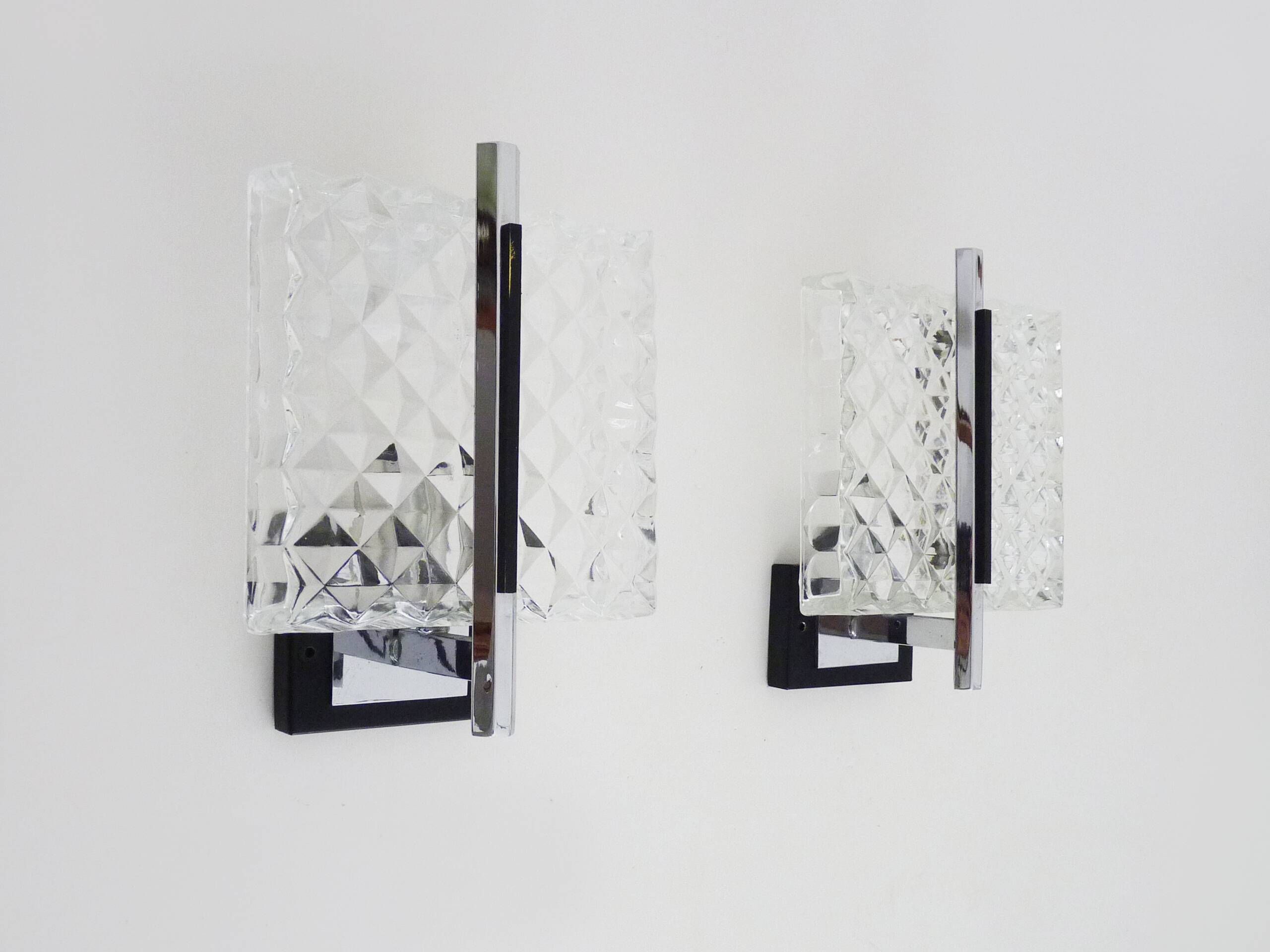 Pair of modernist glass and chrome metal wall sconces. 1960s-70s