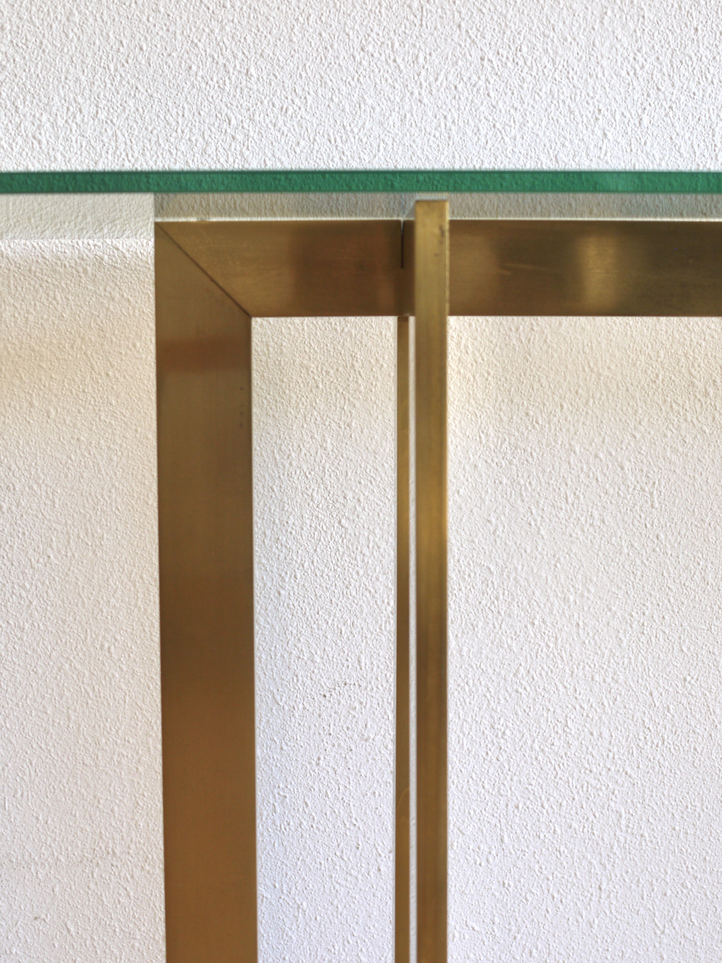 Modernist brass and glass console table & mirror. 1970s