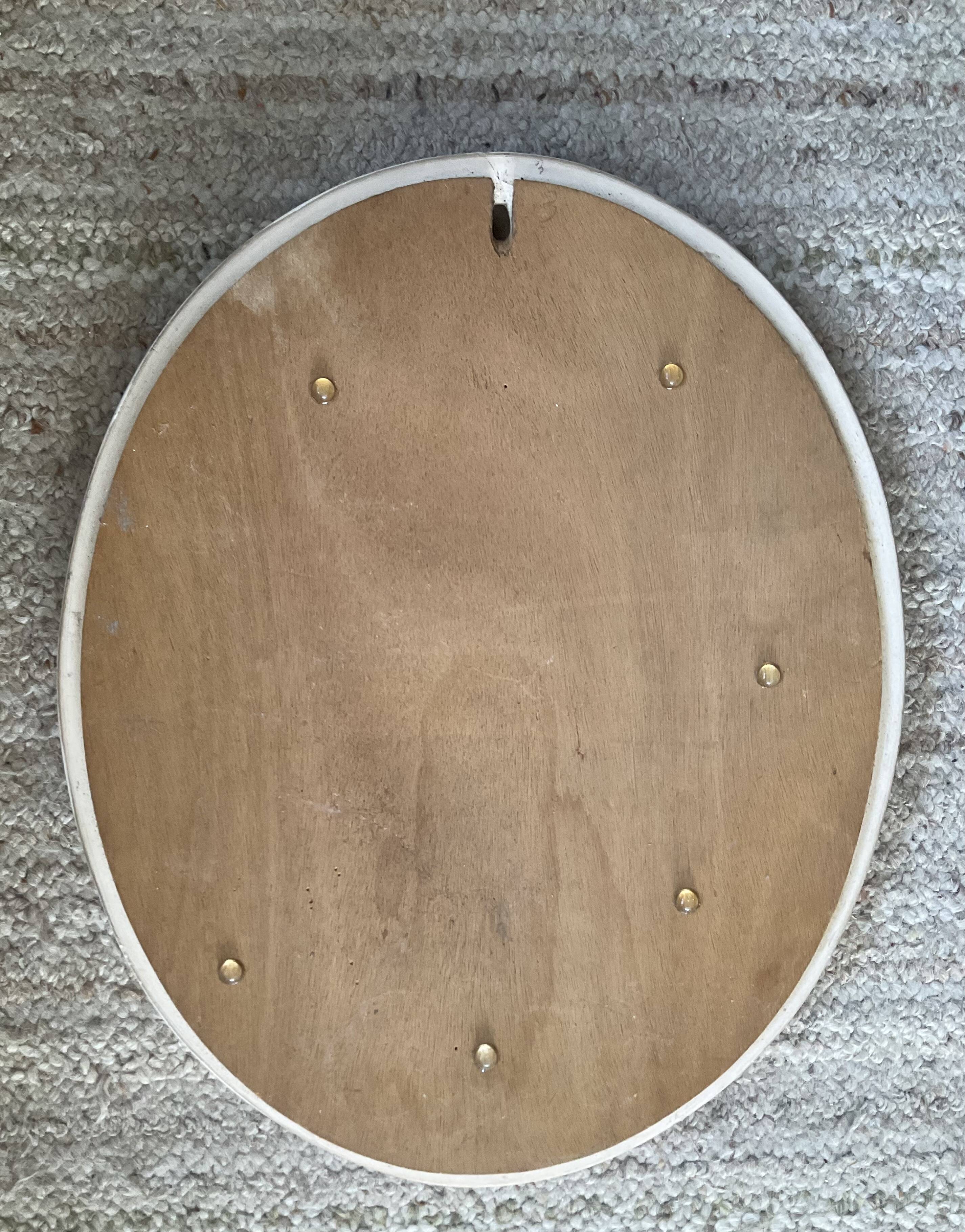 Vintage oval mirror in glazed earthenware