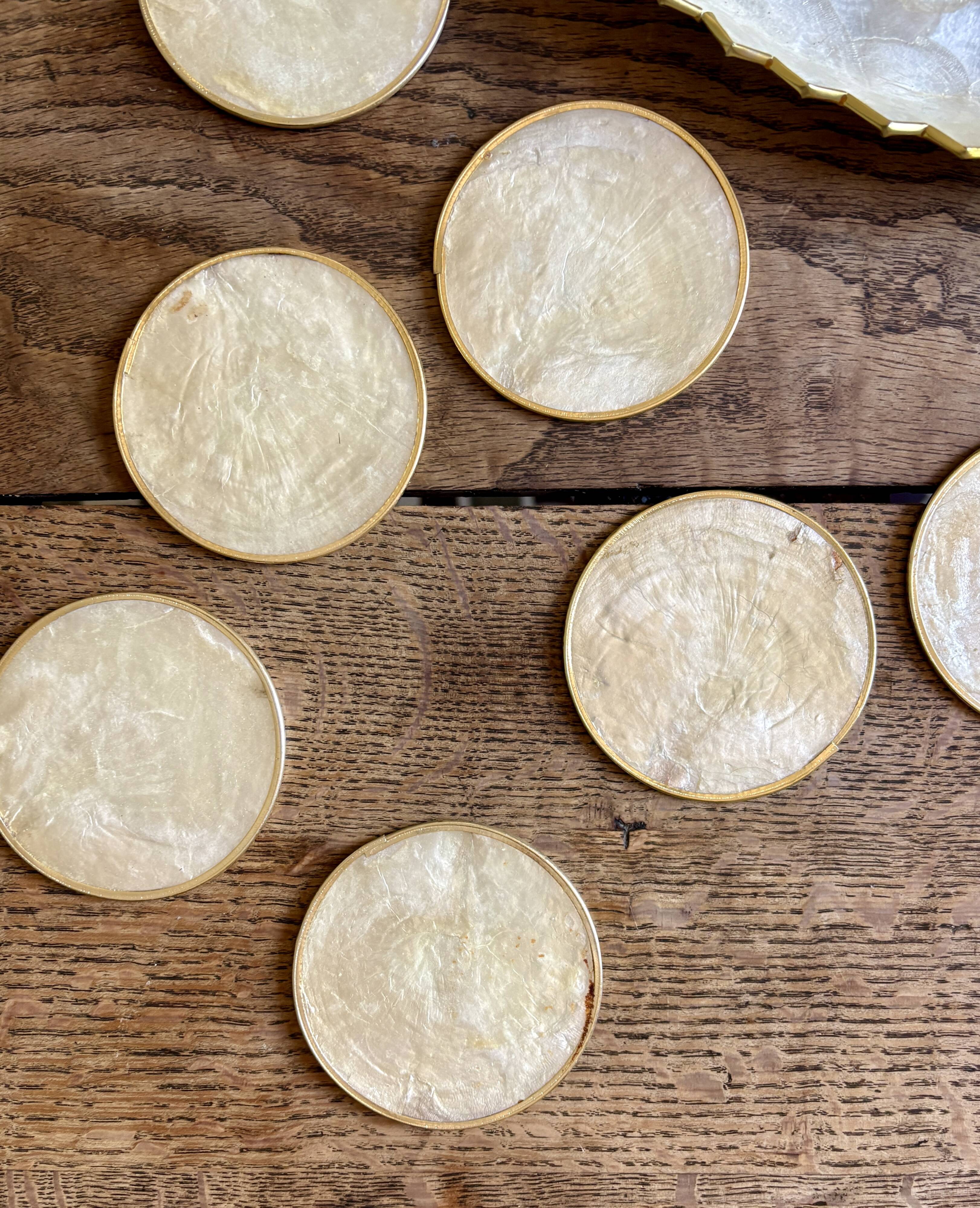 Lot of mother-of-pearl aperitif items, 7 coasters and a dish.
