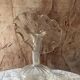 Vintage transparent glass vase in flower shape.