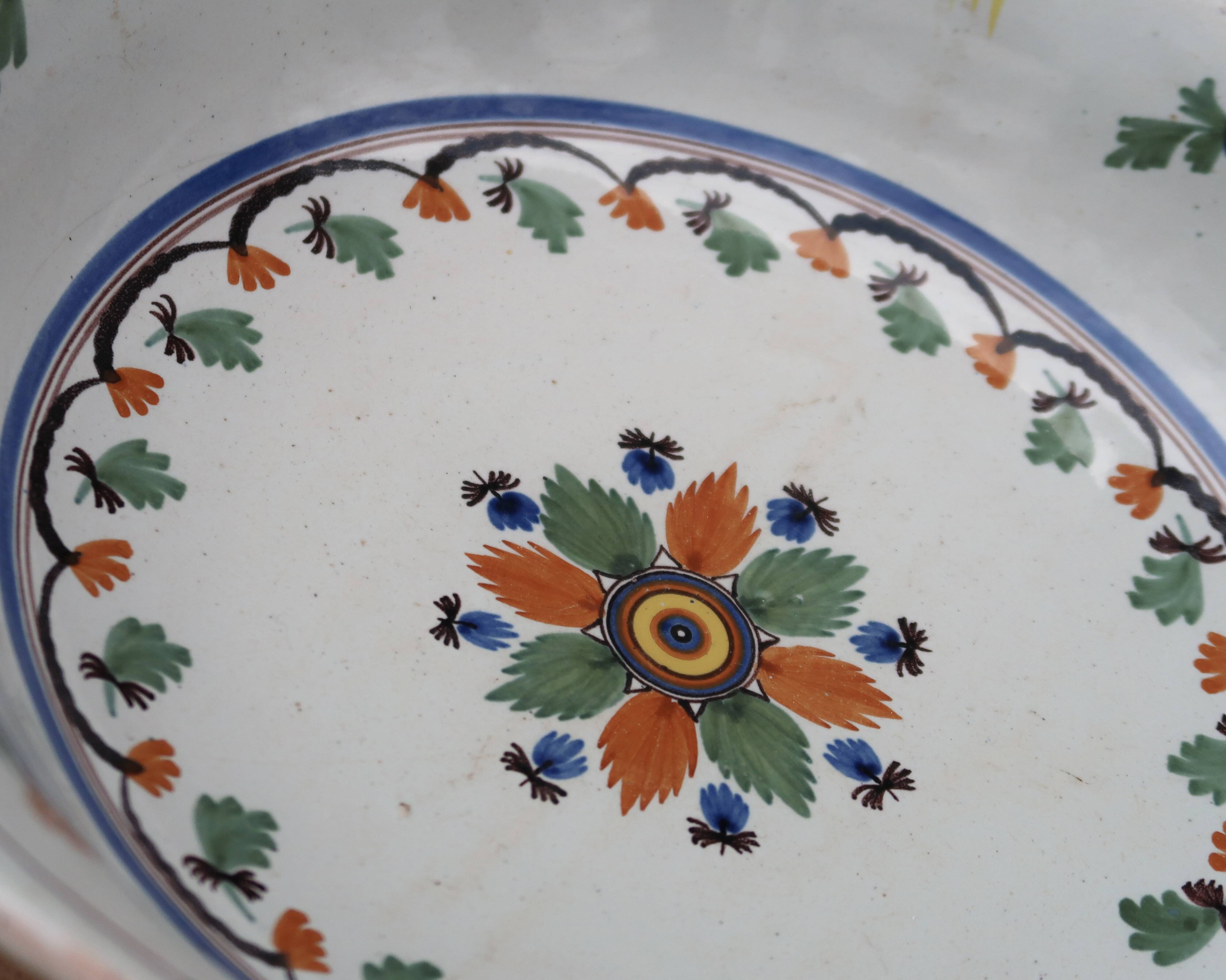 Shallow flat dish in Nevers earthenware from the 18th century.
