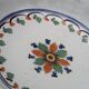 Shallow flat dish in Nevers faience from the 18th century.