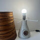 Accolay Lamp, the base in glazed ceramic with openwork decoration.