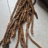 Chokwe Mwana Pwo mask in carved wood with a dark patina and rope hair