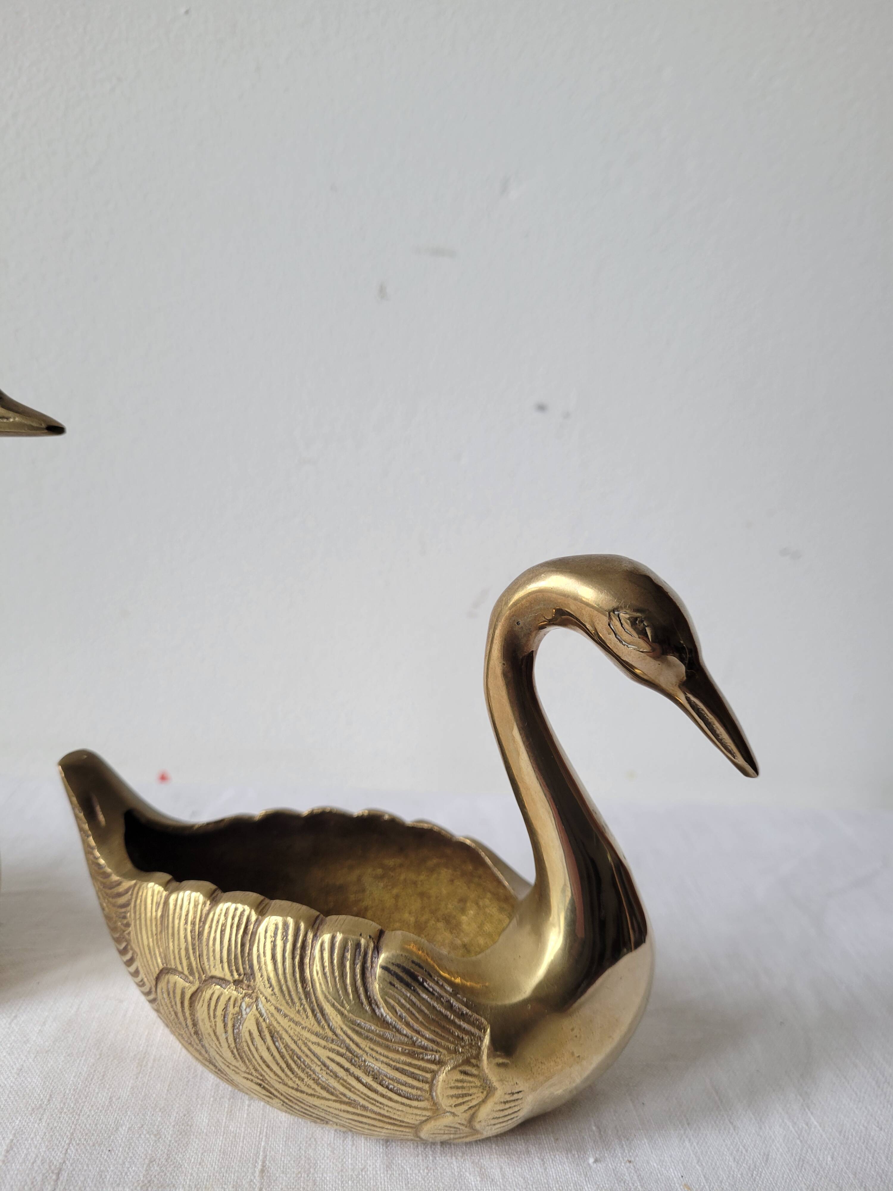 Trio of zoomorphic brass swan empty pockets