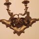 Pair of antique wall sconces in gilded wood from the 19th century.