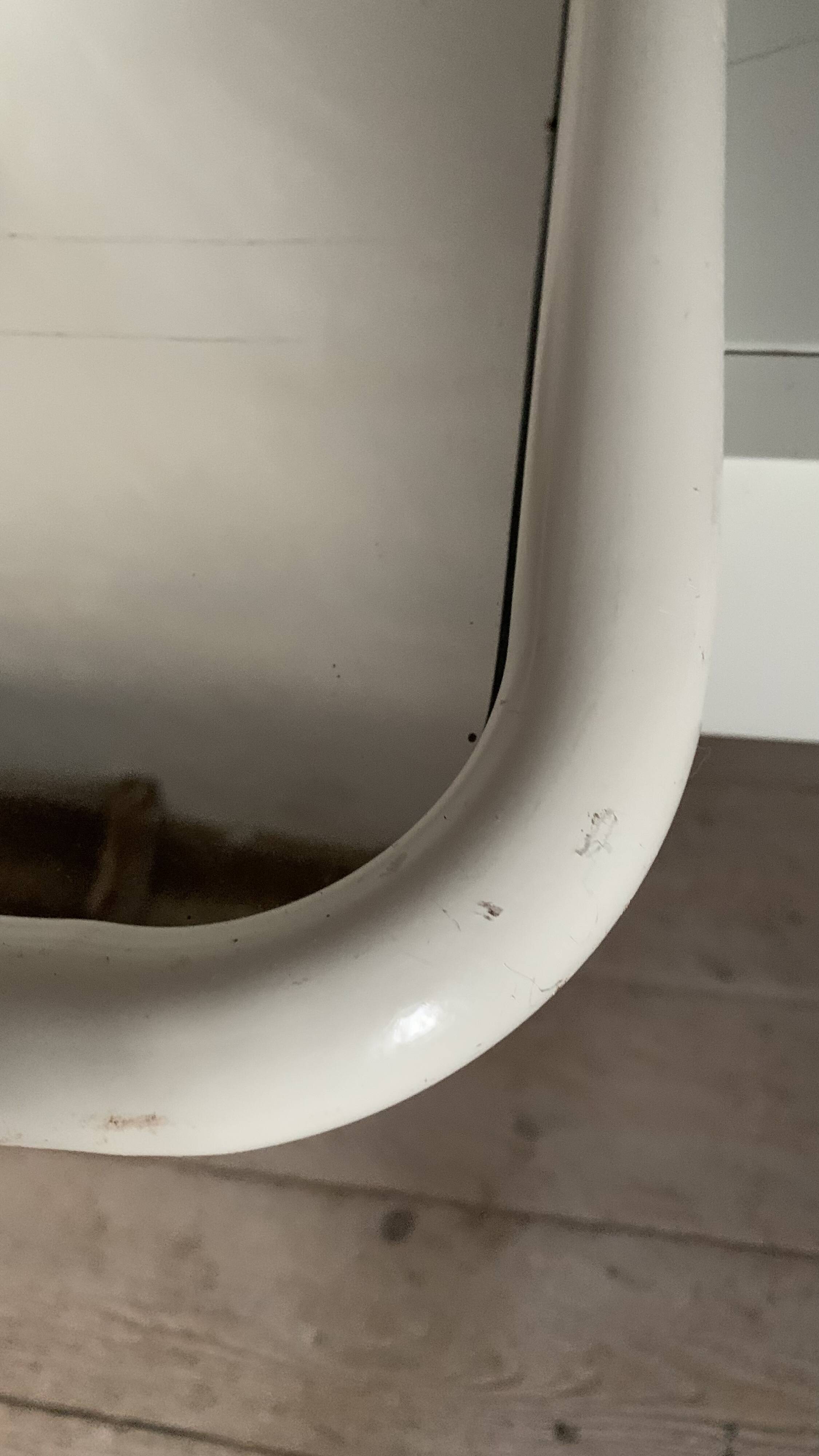 White tubular metal wall mirror