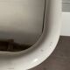 White tubular metal wall mirror