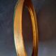 Old golden oval mirror