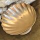Large brass shell-shaped pocket emptier