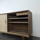 Modernist sideboard in oak with rattan doors.