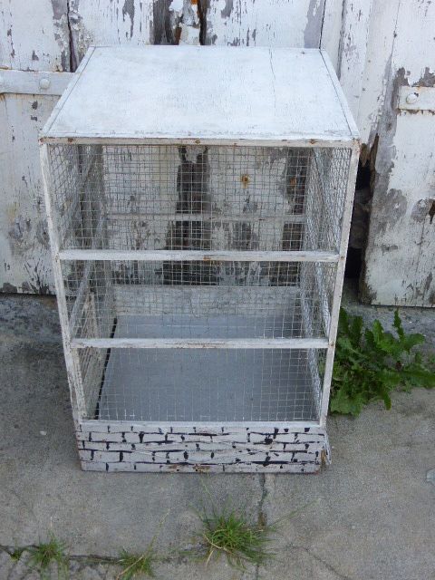Vintage bird cage, made of wood and chicken wire metal square mesh