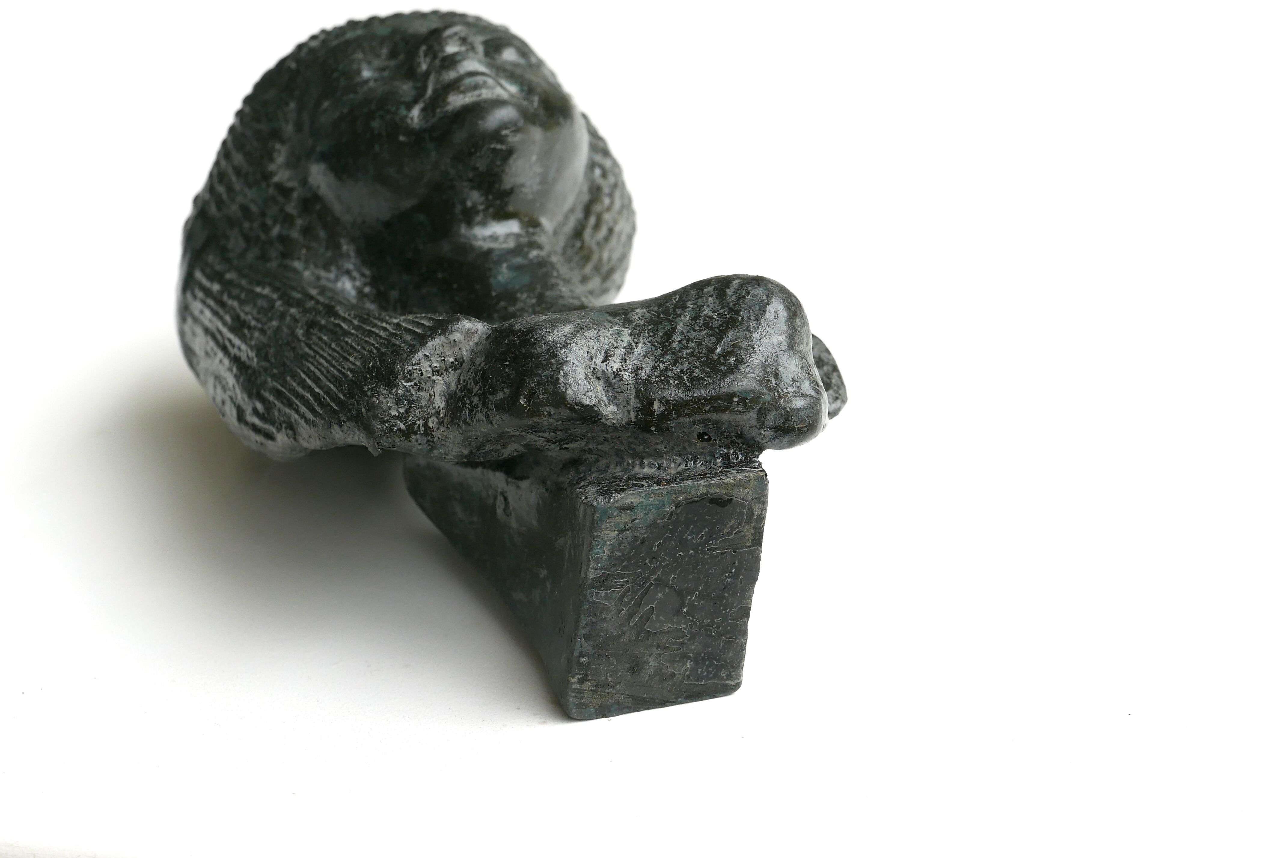 Woman bust in carved stone, 50s