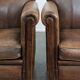 Set of 2 vintage sheepskin armchairs with a characterful appearance