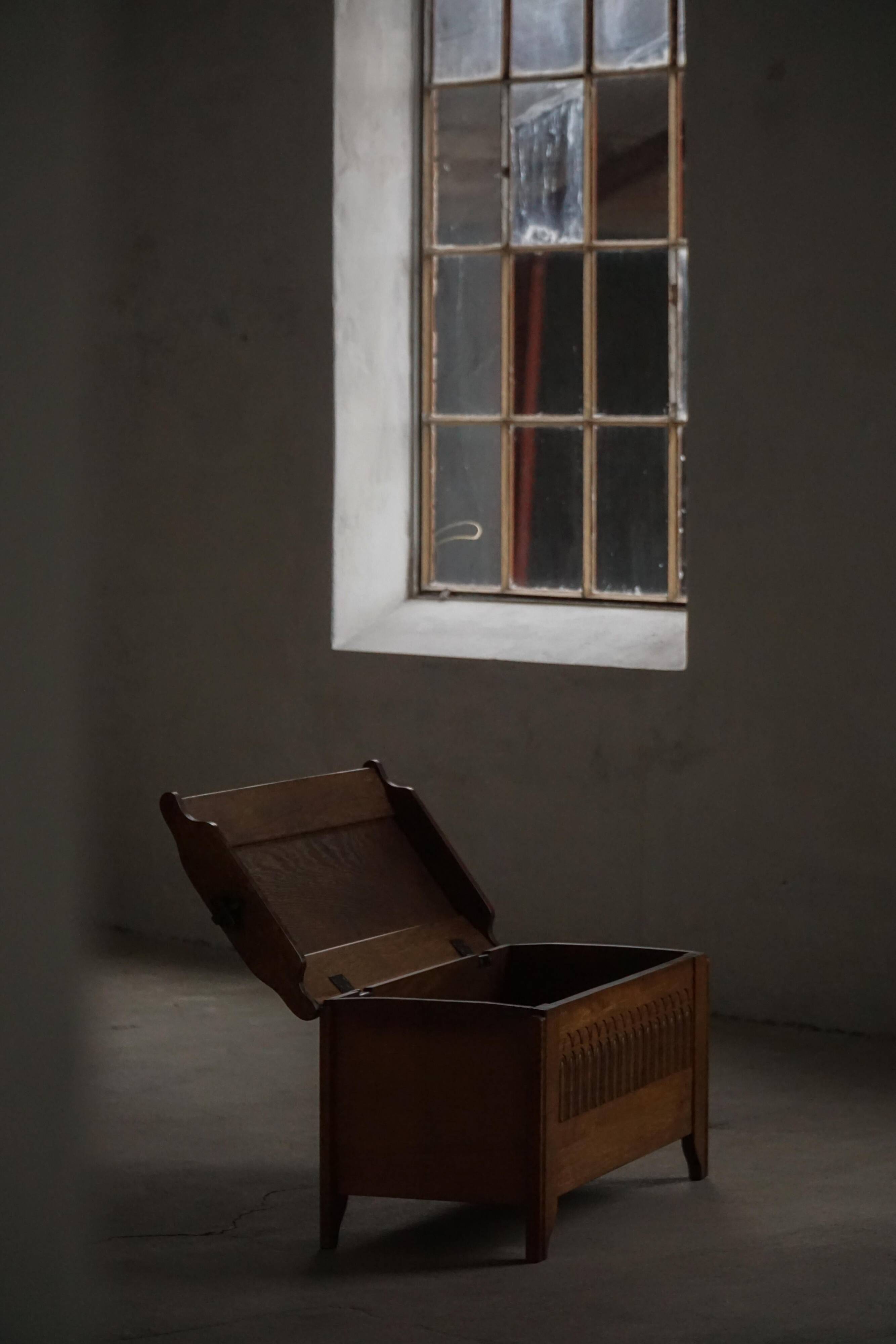 Modern Danish oak commode with decorative relief sculpture, mid-20th century.