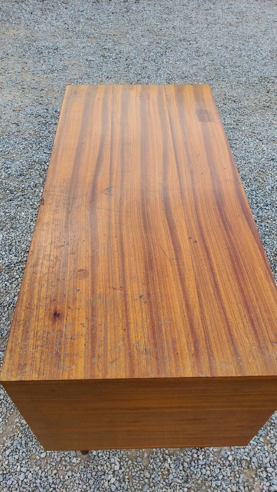 60s desk in golden blond mahogany with conical coffered feet
