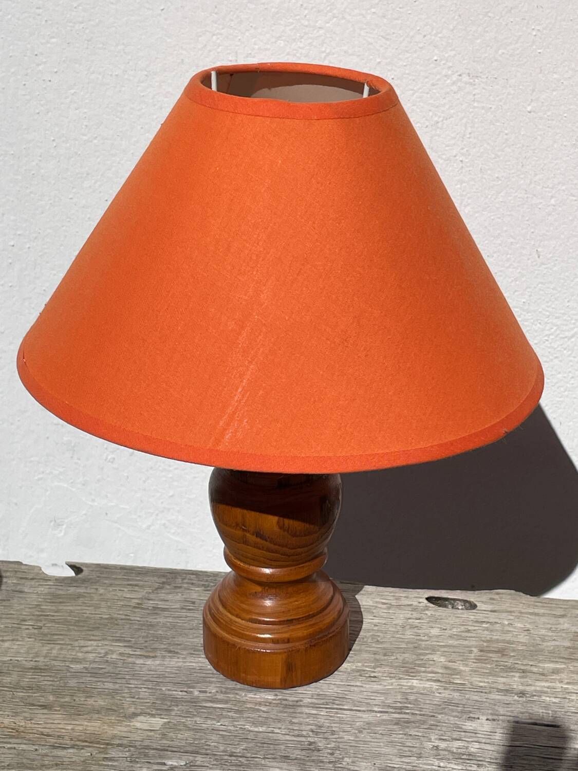 Pair of orange turned wood lamps