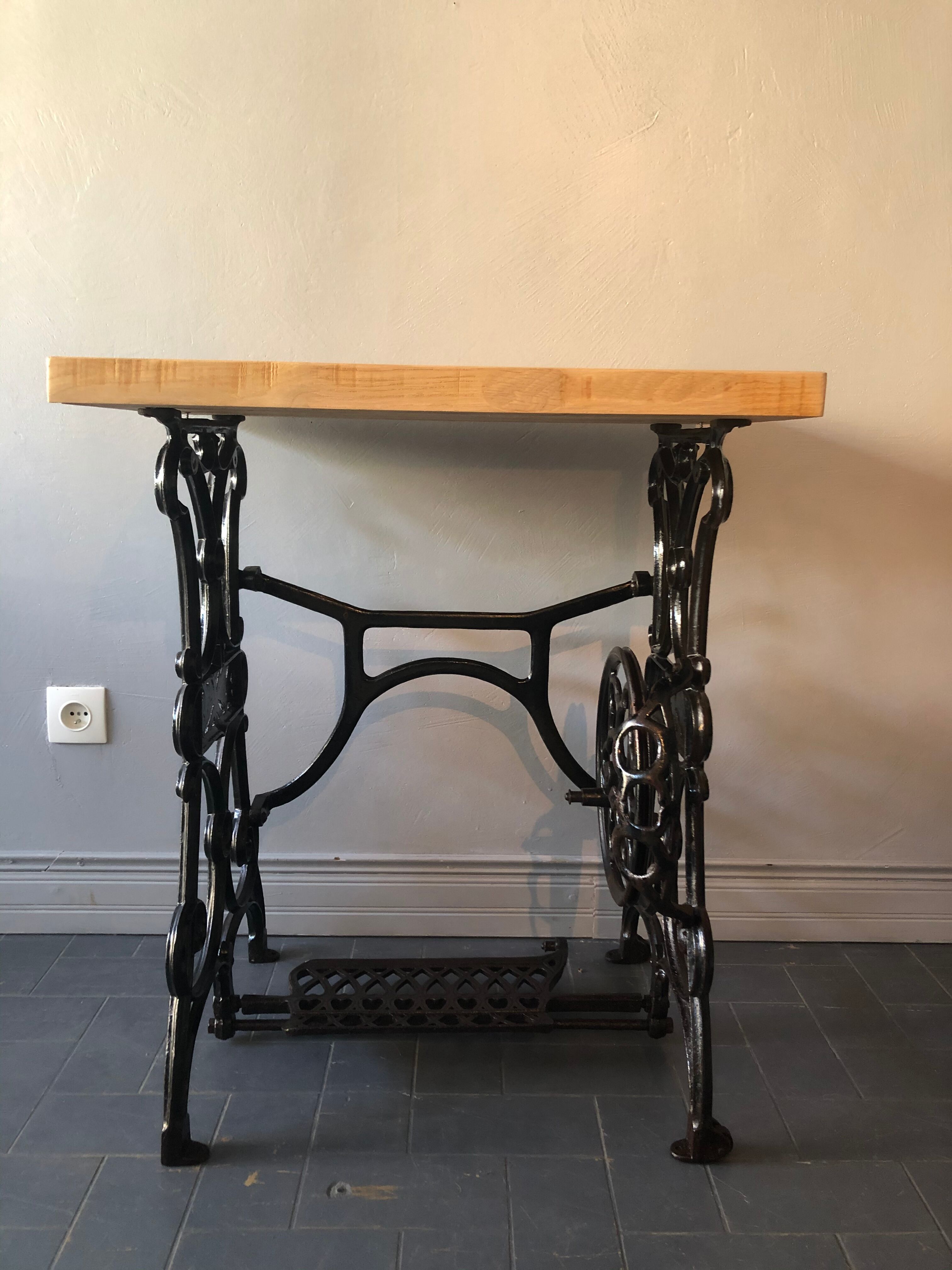 Ancient table, cast iron footing