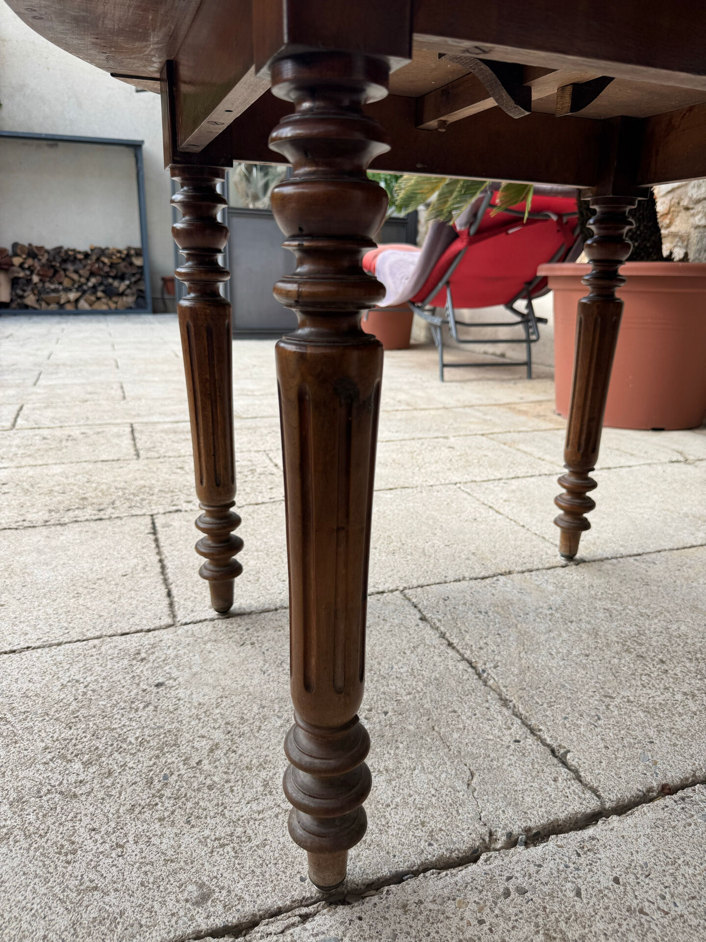 Farm table, two drop-leaves, 19th century, solid walnut.