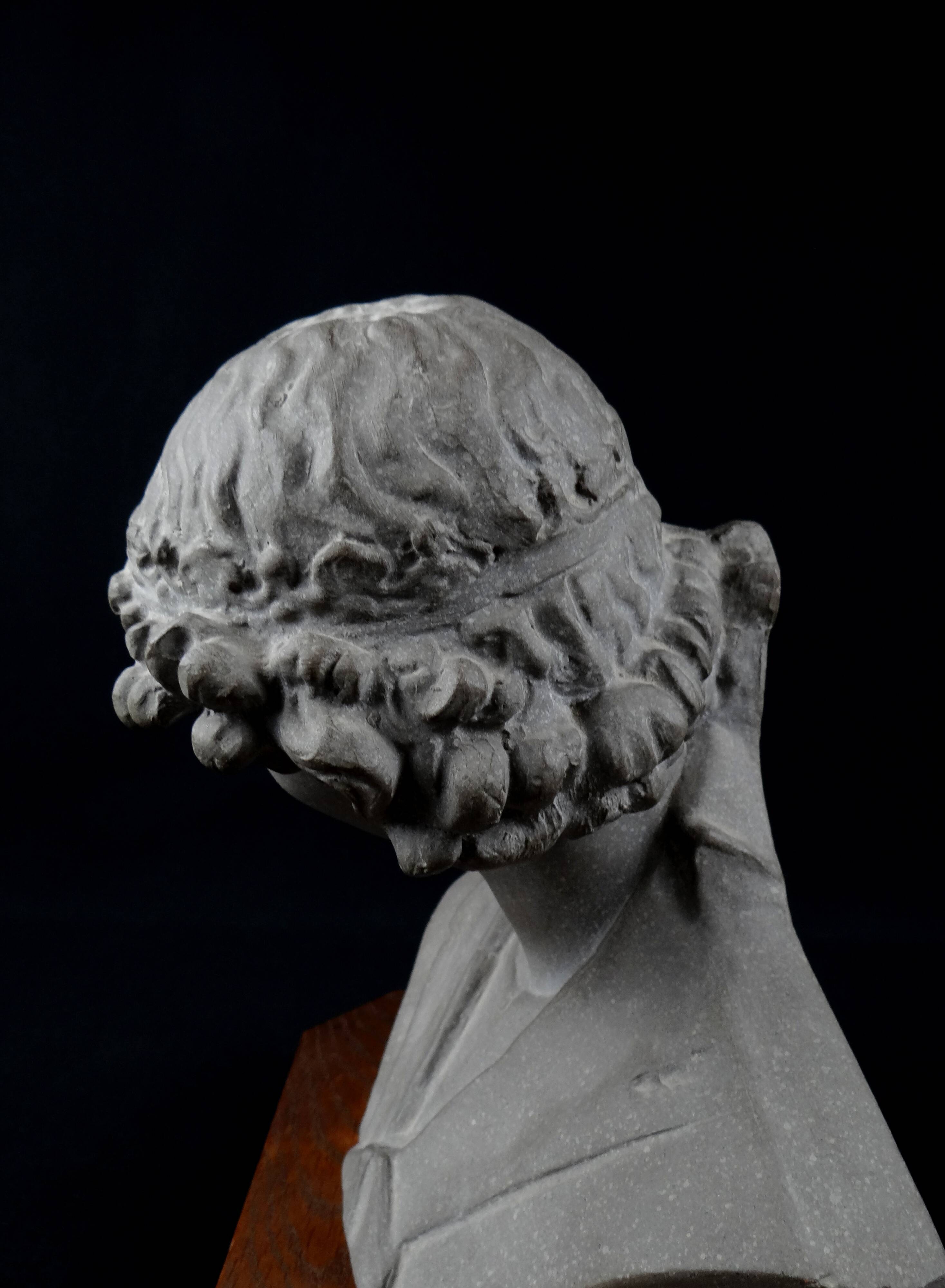 Terracotta bust of the smiling angel from Reims Cathedral with base